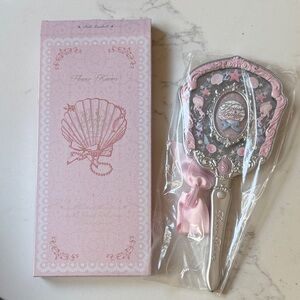 New Flower Knows
 
Shell's Jewel Collection Hand Mirror - pink seashells